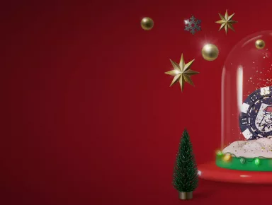 JohnSlots tonttulakissa pelimerkki lasikuvun alla ja ympärillä joulukoristeita