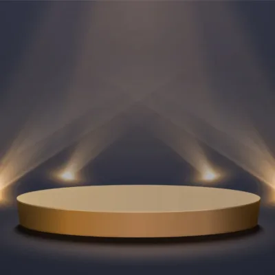 En rund guld cirkel och fyra spotlights på en mörkgrå bakgrund