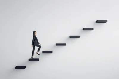 Women walking up a set of steps signifying leadership and career development
