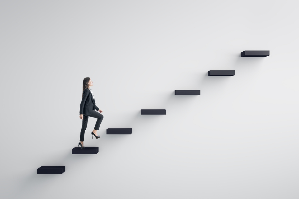 Women walking up a set of steps signifying leadership and career development