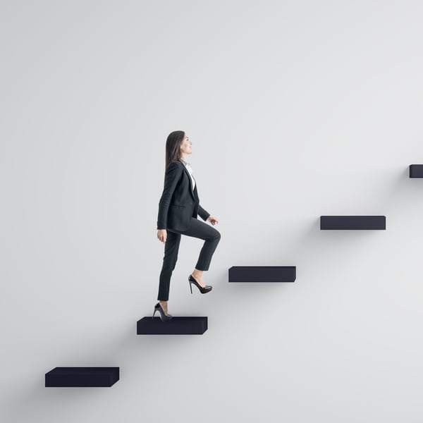 Women walking up a set of steps signifying leadership and career development