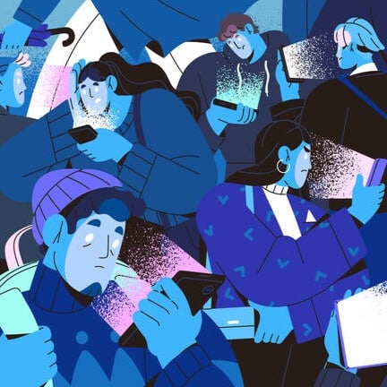 group of people staring at screens